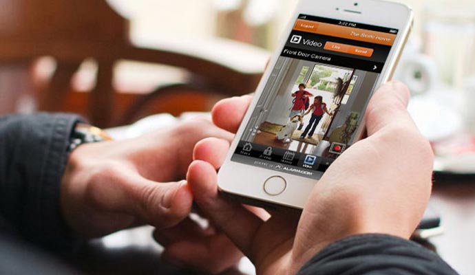 a person using a phone for home monitoring